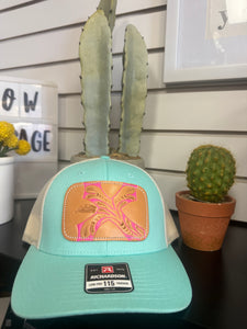 McIntire Teal Trucker Hat with a Leather Pink Patch